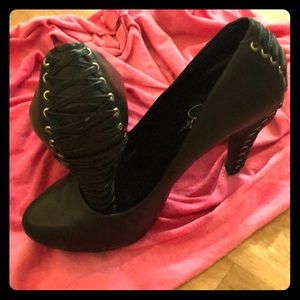 Black leather pumps, with lace up heel. Very chic